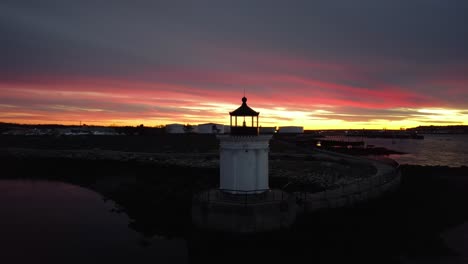 Cinematic-Sunset-in-Portland,-Maine,-aerial-of-Portland-Breakwater-Lighthouse,-Bug-Light