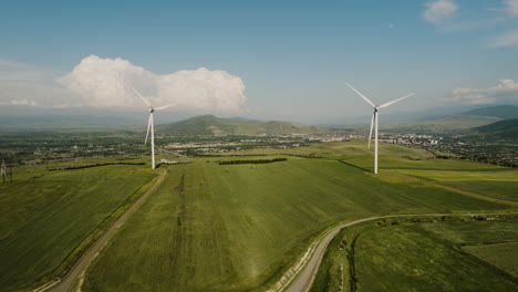 Wind-turbine-generators-slowly-rotating-in-rural-countryside,-Georgia