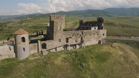 Medieval-Samtsevrisi-castle-stronghold-on-grassy-hilltop-in-Georgia