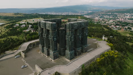 Chronicle-of-Georgia-stone-pillar-monument-on-hill-above-Tbilisi-sea