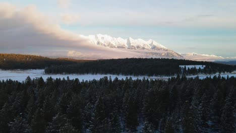 Sunset-in-the-Canadian-Rocky-Mountains:-A-Drone-Tour-of-a-Snowy-Forest