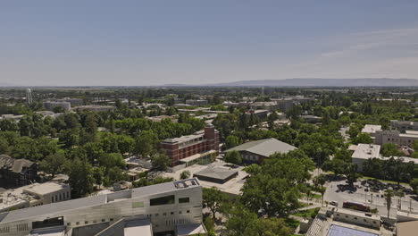Davis-California-Aerial-v4-panoramic-view-low-flyover-university-campus-area-capturing-department-buildings,-school-library,-green-fields-and-lawns-in-summer---Shot-with-Mavic-3-Cine---June-2022