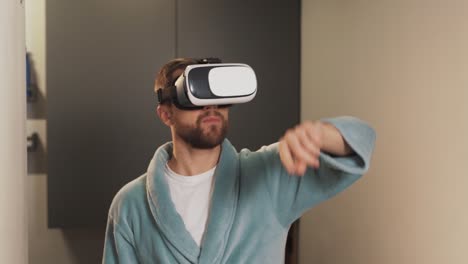 A-handsome-man-in-virtual-reality-glasses-flips-the-pages