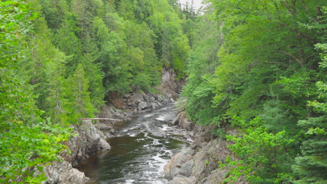 Tighter-shot-of-the-Batchawana-river-flowing-through-the-rocky-forest-of-Ontario-on-it's-way-to-Lake-Superior