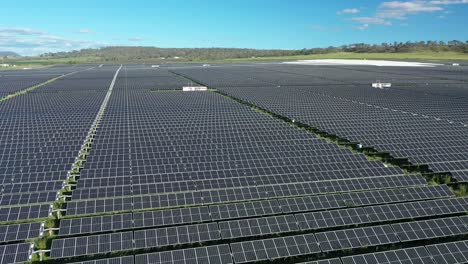Drone-shot-of-Solar-Farm,-camera-orbiting-field-of-solar-panels,-shot-at-mid-day,-in-Warwick-Queensland-Australia-4K