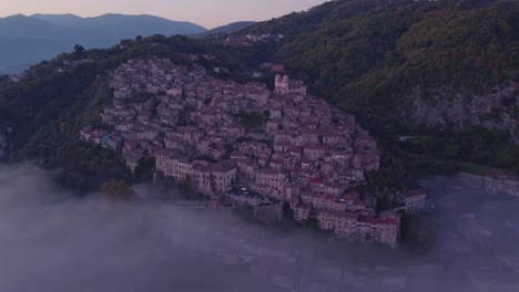 Beautiful-Mediterranean-village-on-mountain-slope-during-sunrise-and-mist,-Artena