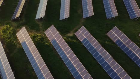 Aerial-view-of-rows-of-many-Solar-Panels-at-photovoltaic-Power-station,-sideways