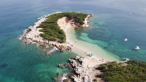 Ksamil-twin-islands,-Pristine-white-sand-beach-surrounded-by-Turquoise-Water,-Albania---Aerial-Orbiting