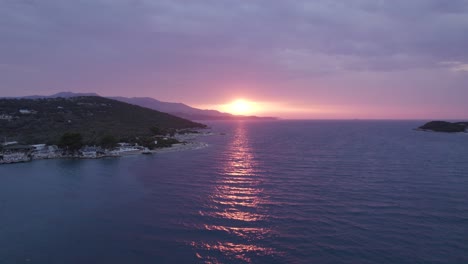 Vibrant-sunset-lights-reflected-on-water's-surface-in-Ksamil-Coastline,-Albania