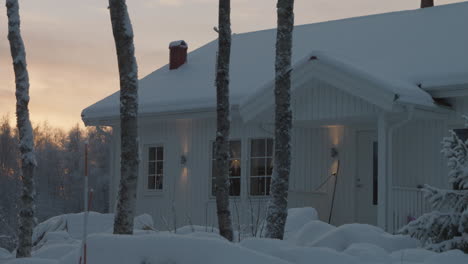 Idyllic-Scandinavian-family-home-in-snowy-winter-wonderland