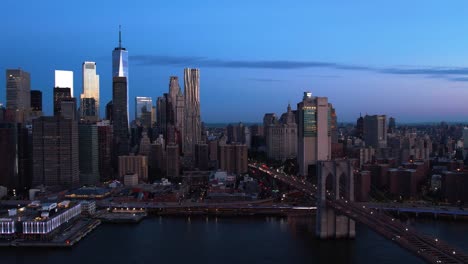 Brooklyn-bridge-and-the-Manhattan-skyline,-colorful-morning-in-NY---Aerial-view