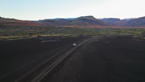 Epic-Icelandic-Landscape-With-White-Land-Rover-Defender-SUV-Driving-On-Road