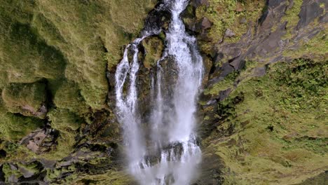 Massive-spectacular-waterfall-gushing-out-of-the-side-of-a-large-mountain