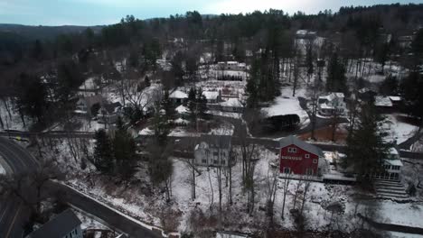 Ascending-aerial-view-of-quaint-Woodstock,-Vermont-in-winter