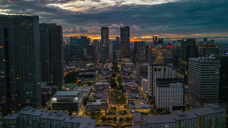 Experience-the-beauty-of-Bonifacio-Global-City-from-a-bird's-eye-view-in-this-aerial-drone-timelapse-of-a-golden-hour-sunset-in-Metro-Manila,-Philippines