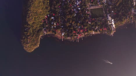 Epic-sunrise-drone-flight-over-San-Marcos-la-Laguna-in-Lake-Atitlan,-Guatemala