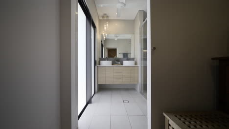 Bedroom-into-Luxurious-modern-bathroom-ensuite,-mirror-drop-down-lighting