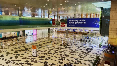 Interior-view-inside-international-terminal-in-daytime-without-people-due-to-coronavirus-outbreak-covid-19-crisis