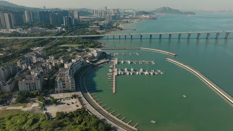 Guangzhou-Nansha-Port-marina-in-China,-aerial-view-on-moored-yachts-near-Nansha-Stone-Inn-hotel