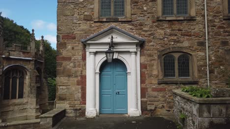 Wide-shot-of-St-James's-blue-door-in-Holywell
