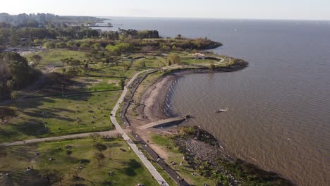 A-tilting-aerial-shot-of-a-public-park-at-the-coastal-area-in-Buenos-Aires,-Argentina