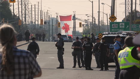 21-September-2022---Police-Waiting-Around-In-Middle-Of-Closed-Road-For-Funeral-Procession-For-Police-Officer-Andrew-Hong-At-The-Toronto-Police-Services