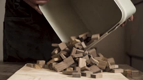 Shot-of-a-bucket-dropping-wooden-squares