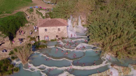 Popular-Saturnia-spa-pools-with-hot-water-in-Italy,-aerial