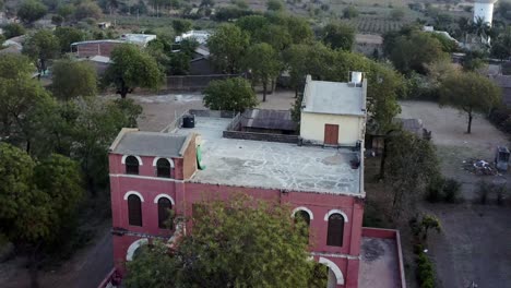 Drone-shot-of-a-building-in-Kerwada-village-in-Gujarat,-India