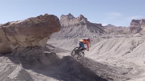 Mountain-biker-jumping-in-front-of-camera-with-camera-push