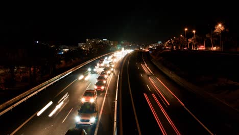 Beautiful-timelapse-of-the-TF-1-highway-on-Las-Americas-at-night,-rush-hour-traffic-jam,-light-streaks,-wide-shot