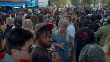 Crowd-of-people-on-street-at-Notting-Hill-Carnival-partying-and-happy