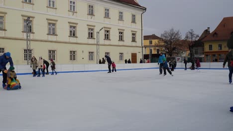 People-Ice-Skating-Outdoor-During-Christmas-Holidays