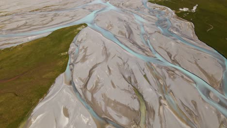 Aerial-establishing-shot-of-beautiful-glacier-river-delta-in-the-southern-Alps-of-New-Zealand