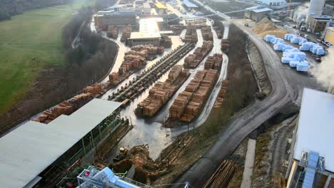 Aerial-view-of-large-piles-of-logs-at-a-german-sawmill-in-the-sauerland-north-rhine-westphalia
