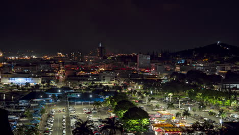 Timelapse-of-nightlife-at-Port-Moselle,-downtown-Noumea-in-background