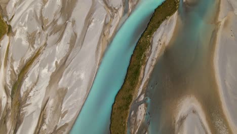 Overhead-fly-over-of-picturesque-turquoise-river-delta-in-New-Zealand