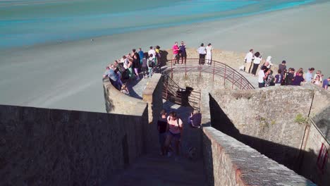 People-on-holiday-enjoying-the-scenic-view-from-this-viewing-point-at-Mont-Saint-Michel,-France