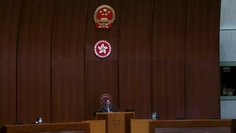 A-wide-shot-view-of-Hong-Kong-Legislative-Council-President,-Andrew-Leung-,-is-seen-sitted-on-the-president-elected-chair-during-a-meeting-at-the-Legislative-Council's-main-chamber-in-Hong-Kong