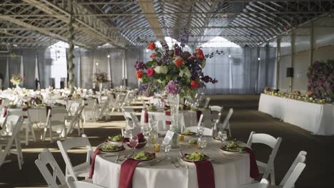 Flower-bouquet-arrangement-on-a-wedding-banquet-dining-table-in-venue-hall
