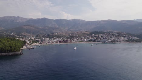 Aerial-View-Of-Spile-Beach-Coastline-With-Mountains-In-Background