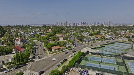 San-Diego-California-Aerial-v59-cinematic-low-flyover-glorietta-bay-marina-capturing-coronado-residential-neighborhood-with-downtown-cityscape-on-the-skyline---Shot-with-Mavic-3-Cine---September-2022