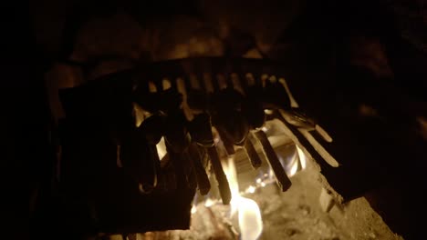 Wild-foraged-mussels-slowly-cook-above-an-open-log-fire-in-an-old-fireplace
