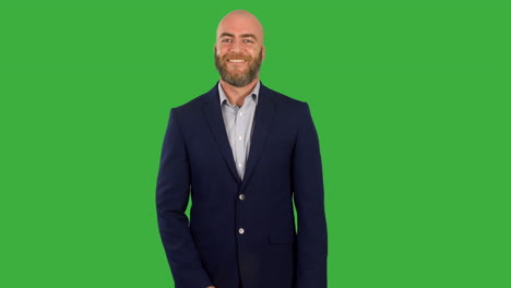 A-businessman-with-a-beard-nodding-yes-in-agreement-on-green-screen
