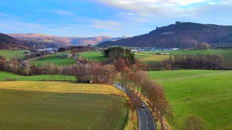 Early-Morning-Light-in-Bruchhausen-an-den-Steinen:-An-Aerial-View-of-the-Landscape-and-Small-Road-Hochsauerland