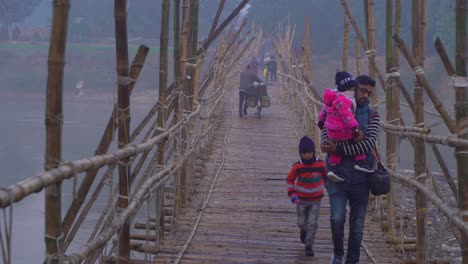 In-winter,-a-bamboo-bridge-is-constructed-on-the-river-due-to-the-water-shortage-and-the-people-of-the-upper-and-over-the-road-pass-through-it
