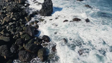 Aerial-top-view-of-waves-break-on-rocks
