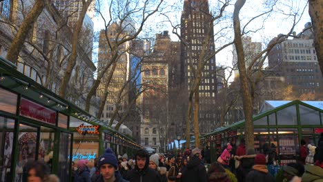 Crowded-People-Rushing-At-The-Shops-Along-Bryant-Park-Christmas-Market-In-Manhattan-Midtown,-New-York-City,-USA