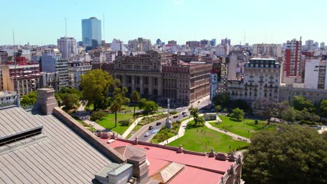 Drone-shot,-aerial-view-of-the-Argentine-flag-with-Lavalle-square-and-the-TSJ-Supreme-Court-of-Justice,-Buenos-Aires-microcenter