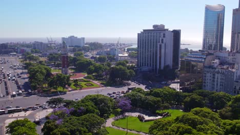 Aerial-view-dolly-in-of-the-monument-to-the-fallen-in-the-Malvinas-War-and-the-monumental-tower-in-the-Retiro-neighborhood,-Buenos-Aires